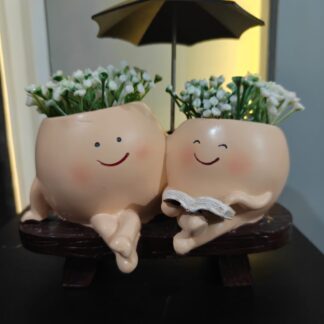 mother and kid smiley planter with umbrella
